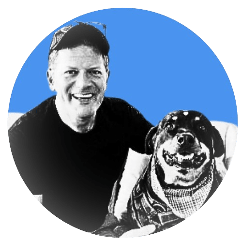 A man and his dog are smiling for the camera.
