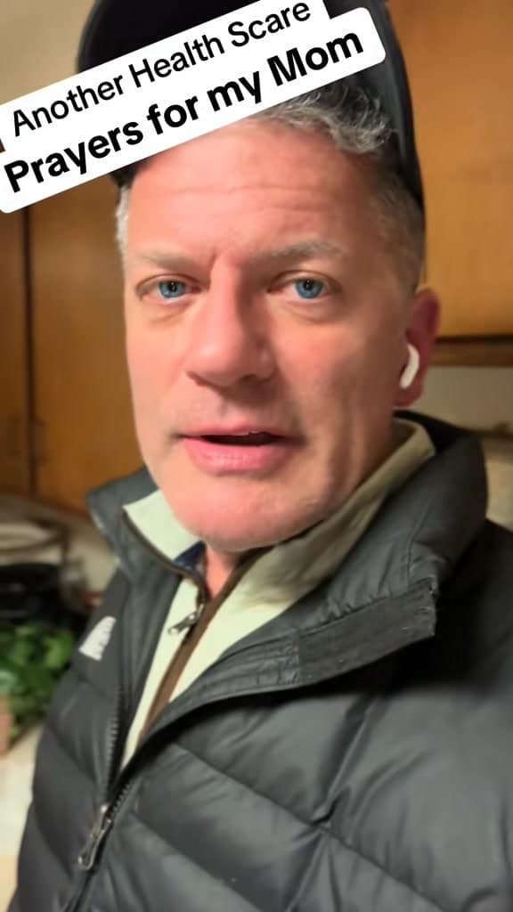 A man with ear buds in his ears.