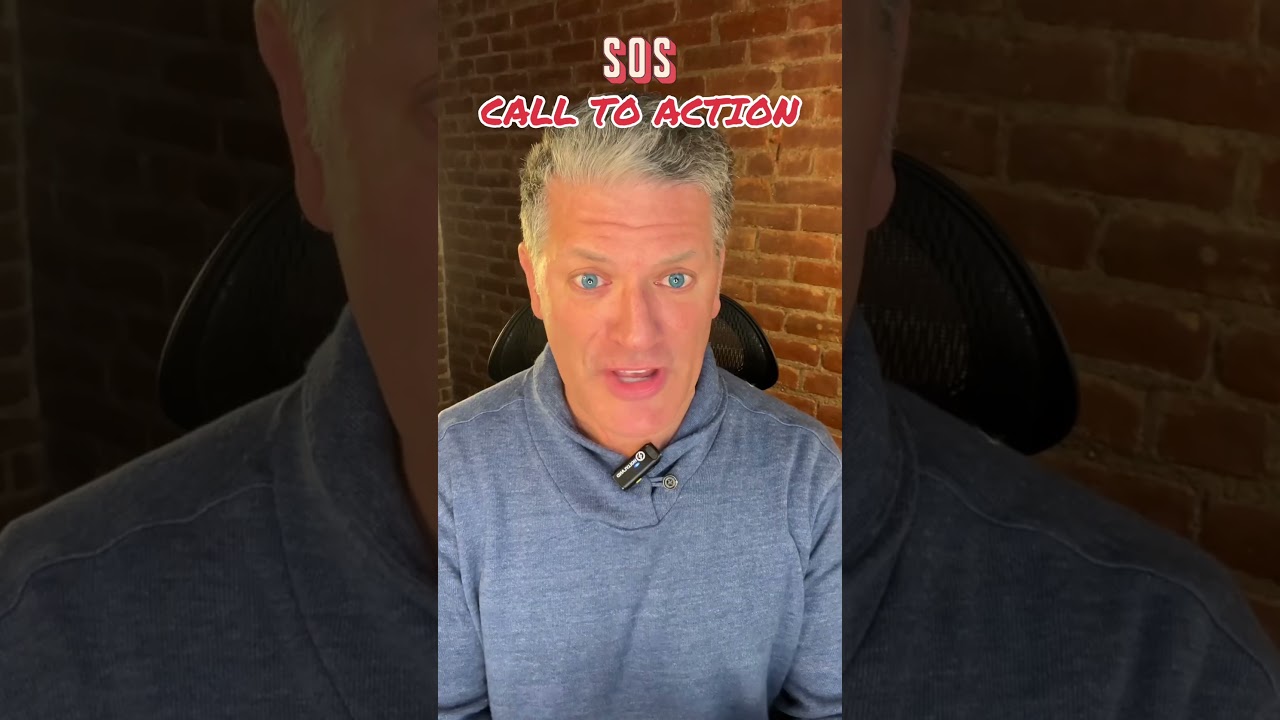 A man with gray hair is talking to someone.