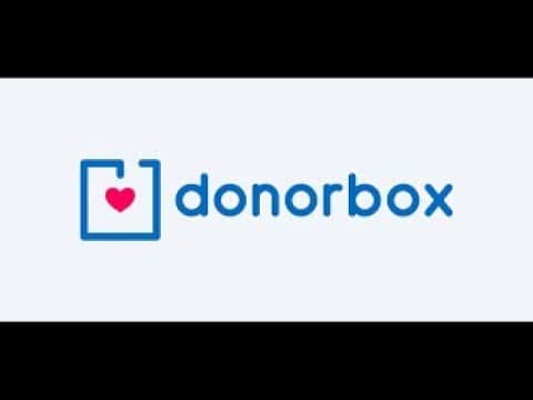 A blue and white logo with red heart on it.
