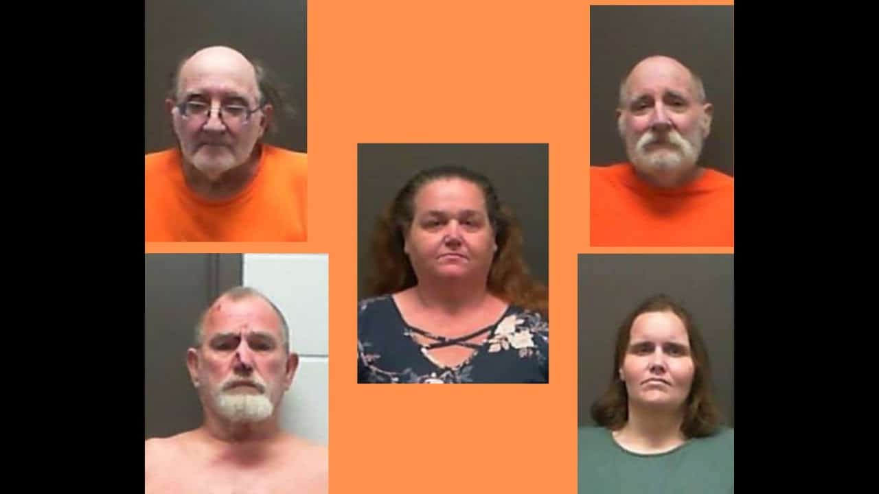 A group of people that are posing for the camera.